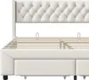 A close-up, front view of a beige upholstered bed frame with a tufted headboard and wooden slats for the mattress. Anteprima dell’immagine prodotto