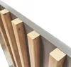 A close-up view of wooden slats and a gray surface, likely part of a piece of furniture. Náhled obrázku produktu