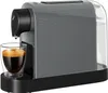 A grey Tchibo Cafissimo coffee machine with a glass cup of espresso in front of it. Podgląd zdjęcia produktu