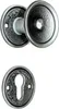 A set of door handles and a keyhole escutcheon plate, both with a textured, antique-looking finish. Produktbild-Vorschau
