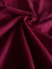 A close-up, folded view of a soft, textured fabric in a deep red color. Produktbild-Vorschau