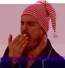 A man wearing a striped nightcap yawns. Produktbild-Vorschau