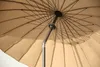 The underside of a beige umbrella, showing the metal ribs and central pole. Anteprima dell’immagine prodotto