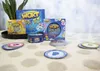 Several boxes and tins of the card game Wortblitz are arranged on a textured surface, with some game cards scattered in the foreground. Produktbild-Vorschau