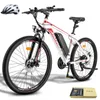 A white electric mountain bike with red accents is shown against a white background. A white helmet is placed to the left of the bike. Náhled obrázku produktu