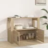 A wooden sideboard with open doors, displaying jars and a basket inside. Podgląd zdjęcia produktu
