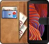 A book-style phone case with a Samsung Galaxy XCover 5 phone inside, showing cards and euro banknotes in the case's slots. Produktbild-Vorschau