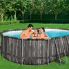 A family is enjoying a swim in an above-ground pool in a backyard setting. Náhled obrázku produktu
