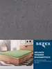 A product image showing a bed with a green fitted sheet and a dark grey background. Produktbild-Vorschau