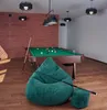 A billiard room with a pool table, a green beanbag chair, and a footstool. Náhľad obrázku produktu