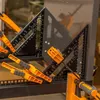 Several carpenter squares and clamps are arranged on a workbench. Produktbild-Vorschau