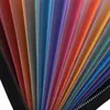 A close-up view of an open accordion file organizer with multiple colored plastic dividers. Produktbild-Vorschau