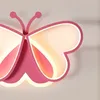 A close-up view of a pink butterfly-shaped ceiling light. Produktbild-Vorschau