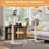 Two adjustable height desks are shown in a living room setting, one next to a sofa and the other near a bookshelf. Produktbild-Vorschau
