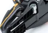 A close-up view of the handle and part of the engine housing of a black and yellow chainsaw. Produktbild-Vorschau