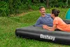 A couple relaxing on an inflatable mattress outdoors. Náhled obrázku produktu