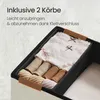 Close-up view of an organizer insert with folded clothing items inside, placed within a larger storage container. Produktbild-Vorschau
