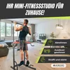 A man is using a home fitness station in a living room. Náhľad obrázku produktu