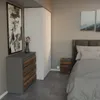 A bedroom scene featuring a dresser and a bed. Voir les images du produit