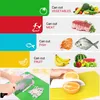 A collage of images showing different colored cutting boards with food icons and examples of food that can be cut on them, as well as a person using a green cutting board and another image showing sliced oranges on yellow and white cutting boards. Produktbild-Vorschau