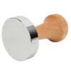 A coffee tamper with a silver base and a wooden handle, isolated on a white background. Náhled obrázku produktu
