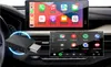 A car's dashboard with two screens showing smartphone integration interfaces and a USB adapter. Podgląd zdjęcia produktu