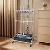 A cleaning tool organizer stand with mops and a broom is shown in a room with curtains and a dresser. Podgląd zdjęcia produktu