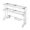 A two-tier stainless steel dish drying rack with various compartments and hooks, shown against a white background. Podgląd zdjęcia produktu