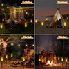 A collage of four images showing solar flame lights used in different outdoor settings and seasons: a family dinner in spring, a camping scene in summer, a couple by a campfire in autumn, and a family around a bonfire in winter. Produktbild-Vorschau