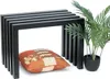 A black metal bench with a pillow underneath and a potted plant to the side, on a white background. Produktbild-Vorschau