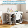 A child's desk and chair set with toys on top, set in a room. Produktbild-Vorschau