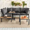 An outdoor patio setting with a sectional sofa, coffee tables, and drinks. Podgląd zdjęcia produktu