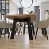 A dining room with a wooden table and chairs, set in a modern interior. Produktbild-Vorschau