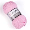 A ball of pink yarn with a label. Podgląd zdjęcia produktu