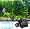 An aquarium with a fish, plants, and a water pump. Podgląd zdjęcia produktu