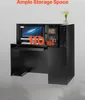 A black reception desk with a computer and decorative items on display. Produktbild-Vorschau