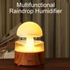 A multifunctional raindrop humidifier with a glowing mushroom-shaped top, placed on a wooden table. Náhled obrázku produktu