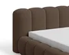 Close-up of a brown upholstered bed frame with a white mattress. Voir les images du produit