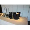 A modern kitchen counter with a sink and several black trash bins. Produktbild-Vorschau
