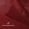 A close-up view of a red fabric, likely a bedsheet, showing its texture and stitching. Náhled obrázku produktu