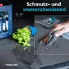 A car trunk with a spilled plant and a hand wiping up water, demonstrating the product's water-repellent feature. Produktbild-Vorschau