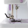 Close-up view of the needle and presser foot of a sewing machine. Podgląd zdjęcia produktu