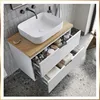 A modern bathroom vanity with a vessel sink and open drawers displaying toiletries and towels. Náhľad obrázku produktu