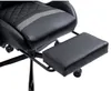 A close-up view of a black gaming chair with a gray stripe and a black footrest extended. Produktbild-Vorschau