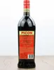 A bottle of Amer Picon aperitif on a wooden surface against a white background. Anteprima dell’immagine prodotto