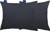 Two dark gray quilted pillows are shown side-by-side against a white background. Produktbild-Vorschau