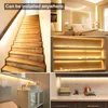 Collage of images showing LED light strips installed in various home settings, including stairs, shelves, a bedroom, a bathroom, and a kitchen counter. Produktbild-Vorschau