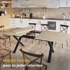 A modern kitchen with a dining table and chairs. Produktbild-Vorschau