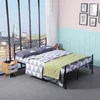 A bedroom scene with a bed, nightstand, and a large window overlooking a city. Voir les images du produit