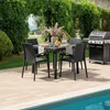 An outdoor dining set with a grill next to a pool. Produktbild-Vorschau